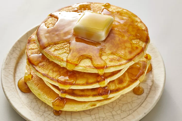 Fluffy pancakes with syrup and butter