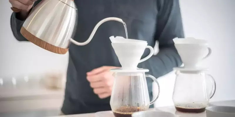 Barista carefully measuring coffee and water for the perfect ratio