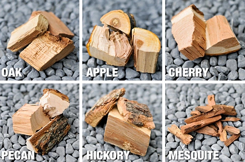 Various types of smoking woods including hickory, apple, and mesquite for diverse BBQ flavors.