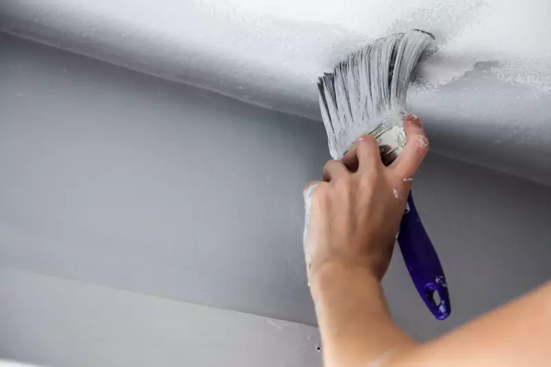 Various techniques of painting a basement ceiling, including flat finish, semi-gloss finish, and exposed beams.