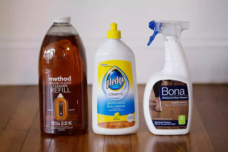 Cleaning solutions in spray bottles for cleaning prefinished hardwood floors.