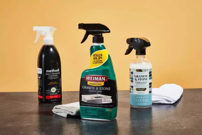 Assorted granite care and maintenance products on a brown granite countertop