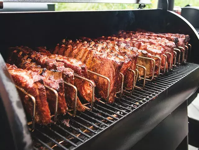 A stainless steel rib rack that optimizes smoker capacity and ensures even cooking.