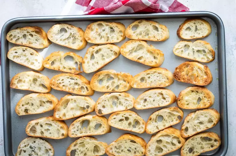 Oven-toasted baguette slices.