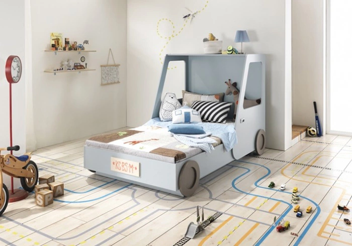 Vibrant toddler boy's room decorated in a vehicle theme, featuring a car-shaped bed and wall decals of different modes of transport.