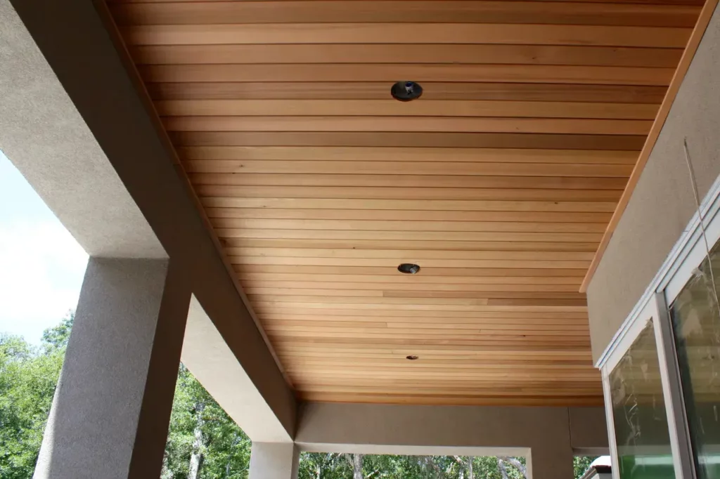 Warm rustic wood plank ceiling on a porch